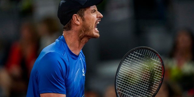 Andy Murray, of Britain, celebrates a point against Dominic Thiem of Austria during their match at the Mutua Madrid Open tennis tournament in Madrid, Spain, Monday, May 2, 2022.
