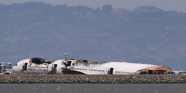 One of the images the passengers reportedly received Tuesday was of Asiana Airlines Flight 214, seen here sitting on the runway at San Francisco International Airport in San Francisco, Calif., after crashing in 2013.