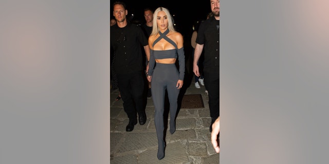 Kim Kardashian arrives in Italy ahead of Kourtney Kardashian and Travis Barker's wedding ceremony.