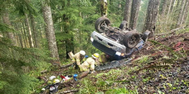 Firefighters conducted a high-angle rope rescue to bring both victims to safety, fire officials said.