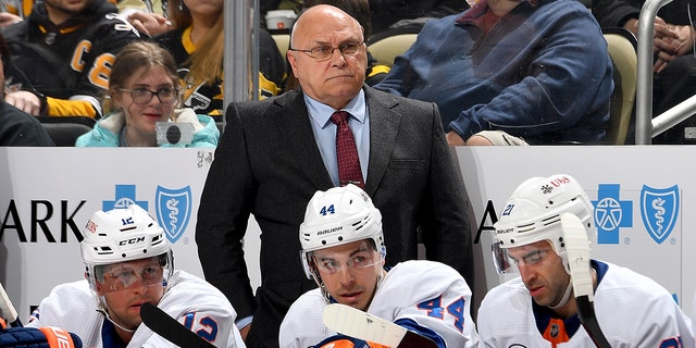 New York Islander Barry Trotz watches the Pittsburgh Penguins at the PPG Paints Arena in Pittsburgh, Pennsylvania on April 14, 2022.