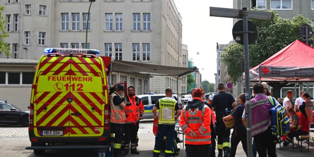 Emergency forces stand near a school in Bremerhaven, Germany, Thursday, May 19, 2022.