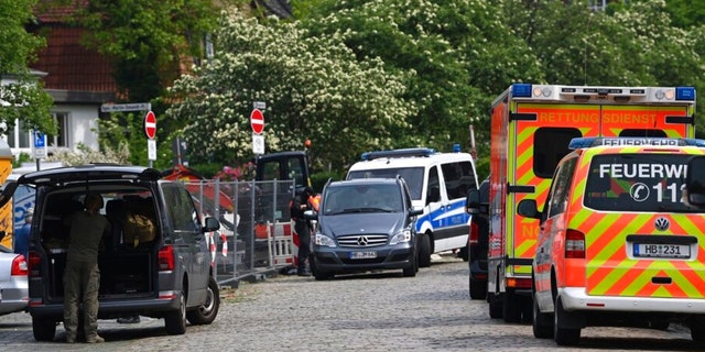 Police and emergency forces stand near a school in Bremerhaven, Germany, Thursday, May 19, 2022. 