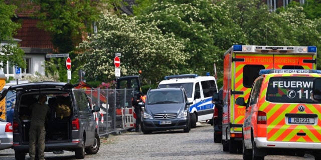 Police and emergency forces stand near a school in Bremerhaven, Germany, Thursday, May 19, 2022. 