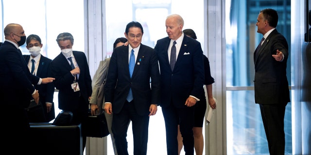 President Biden and Japanese Prime Minister Fumio Kishida walk from a meeting to the G7 family photo at NATO Headquarters in Brussels, Belgium, March 24, 2022.