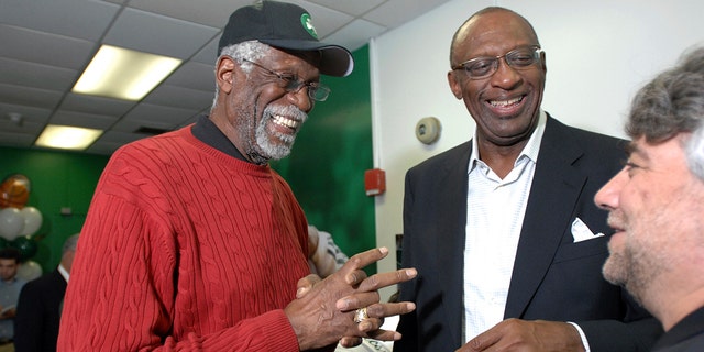 Former NBA players Bill Russell, left, and Bob Lanier share a laugh during the ceremonial opening of a new reading and learning center at a community center Friday, June 6, 2008, in Boston.