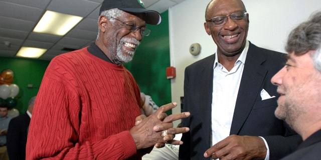 Former NBA players Bill Russell, left, and Bob Lanier share a laugh during the ceremonial opening of a new reading and learning center at a community center Friday, June 6, 2008, in Boston.