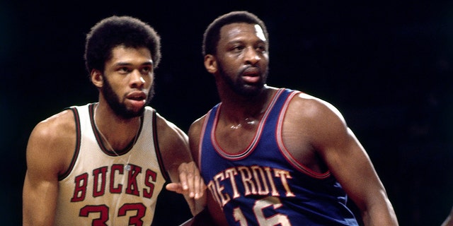 Bob Lanier (16) of the Detroit Pistons posts up against Kareem Abdul-Jabbar (33) of the Milwaukee Bucks during a game in 1974 in Milwaukee.