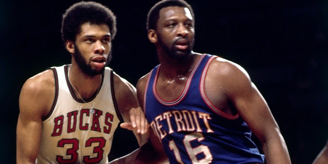 Bob Lanier (16) of the Detroit Pistons posts up against Kareem Abdul-Jabbar (33) of the Milwaukee Bucks during a game in 1974 in Milwaukee.