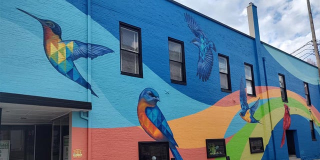 Part of the reason Barnes took such a short trip to the city was because he had to backtrack a little less than 20 miles to get out of Frankfort on the same day. A bird mural in Frankfort is pictured. 