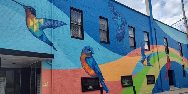 Part of the reason Barnes took such a short trip to the city was because he had to backtrack a little less than 20 miles to get out of Frankfort on the same day. A bird mural in Frankfort is pictured.