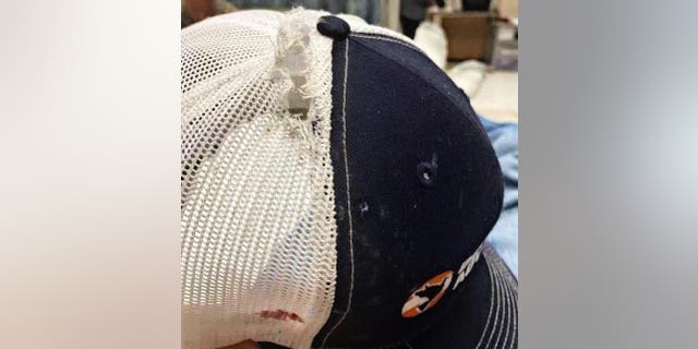 A cap worn by a Border Patrol agent is torn after being struck by a bullet as authorities engaged a gunman who killed 21 people inside a Uvalde, Texas, elementary school on Tuesday.