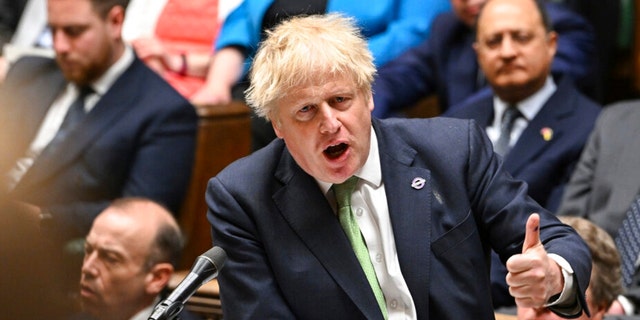 In this photo published by the UK Parliament, British Prime Minister Boris Johnson speaks during the Prime Minister's Questions in the House of Commons, London, May 18, 2022.