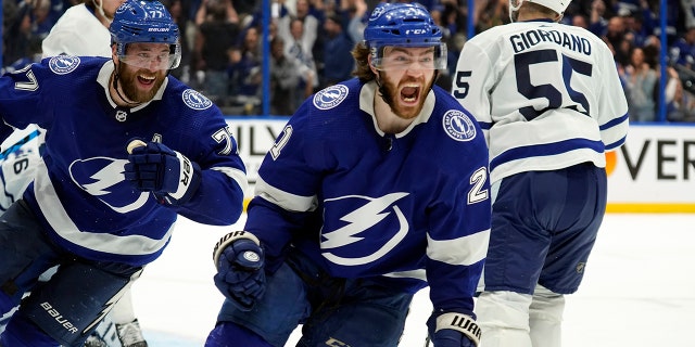 Tampa Bay Lightning center Brayden Point (21) celebrates after scoring the game-winning goal during sudden-death overtime in Game 6 of an NHL hockey first-round playoff series Thursday, May 12, 2022, in Tampa, Fla.