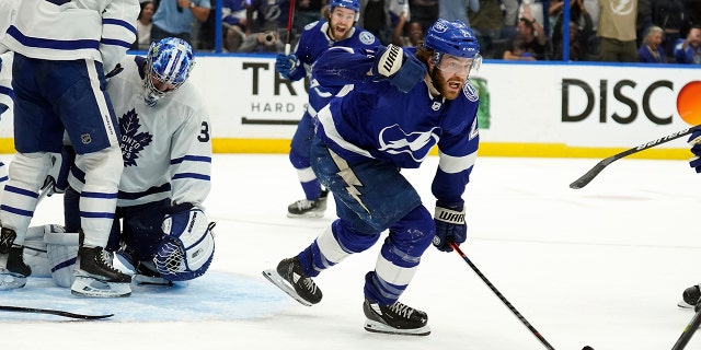 Tampa Bay Lightning center Brayden Point (21) celebrates after scoring pat Toronto Maple Leafs goaltender Jack Campbell (36) during sudden-death overtime in Game 6 of an NHL hockey first-round playoff series Thursday, May 12, 2022, in Tampa, Fla.
