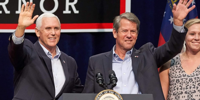 Former Vice President Mike Pence and Georgia Gov. Brian Kemp team up on the campaign trail in Dalton, Georgia in November 2018.