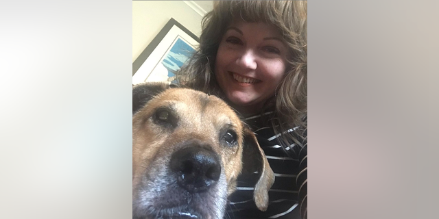 Ohio native Amanda Page is shown in a selfie with her dog, Brodie, in April 2020. (Amanda Page)