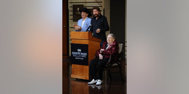Kix Brooks and Ronnie Dunn of Brooks and Dunn speak onstage with Jerry Lee Lewis at the 2022 Country Music Hall of Fame Inductees Presented by CMA at the Country Music Hall of Fame and Museum on May 17, 2022 in Nashville.