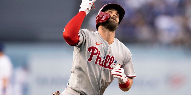 Bryce Harper of the Philadelphia Phillies celebrates his solo home run during the first inning of a baseball game against the Los Angeles Dodgers in Los Angeles, Thursday, May 12, 2022. 