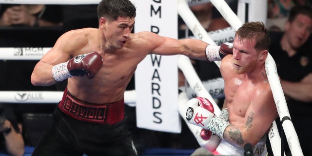 Dmitry Bivol punches Canelo Álvarez on May 7, 2022, in Las Vegas.