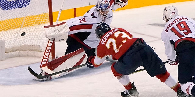 Florida Panthers center Carter Verhaeghe (23) scores a goal against Washington Capitals goaltender Ilya Samsonov (30) during the third period of Game 5 of the first round of the NHL Stanley Cup hockey playoffs, Wednesday, May 11, 2022, in Sunrise, Fla. 