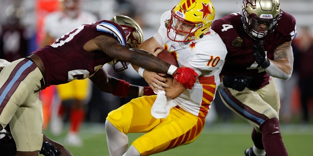 Case Cookus (10) of the Philadelphia Stars runs as Kieron Williams (20) and Frank Ginda (4) of the Michigan Panthers pursue in the fourth quarter of a game May 6, 2022, in Birmingham, Ala.