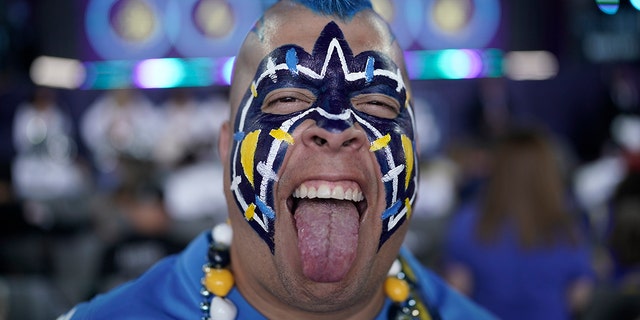 Los Angeles Chargers fan Guillermo Sandoval poses for a portrait before the second round of the NFL Draft on April 29, 2022, in Las Vegas.