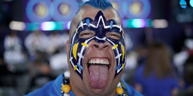 Los Angeles Chargers fan Guillermo Sandoval poses for a portrait before the second round of the NFL draft, April 29, 2022, in Las Vegas.