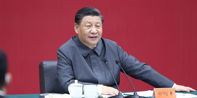 Chinese President Xi Jinping, also general secretary of the Communist Party of China Central Committee and chairman of the Central Military Commission, sits down with representatives of teachers and students at a symposium and delivers a speech during a visit to Renmin University of China in Beijing April 25, 2022. 