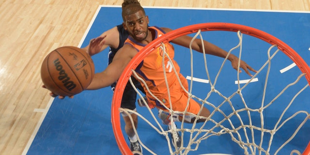 Chris Paul of the Phoenix Suns shoots against the Mavericks during the Western Conference semifinals on May 8, 2022, at the American Airlines Center in Dallas.