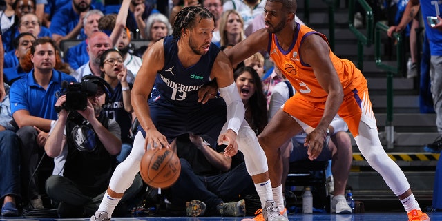 Chris Paul of the Phoenix Suns plays defense on Jalen Brunson of the Mavericks during Game 4 of the 2022 NBA Playoffs Western Conference semifinals on May 8, 2022, at the American Airlines Center in Dallas, Texas.