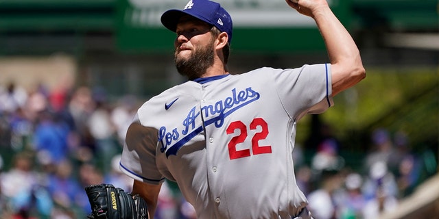Los Angeles Dodgers starting pitcher Clayton Kershaw throws against the Chicago Cubs during the first inning in the first baseball game of a doubleheader, Saturday, May 7, 2022, in Chicago. 
