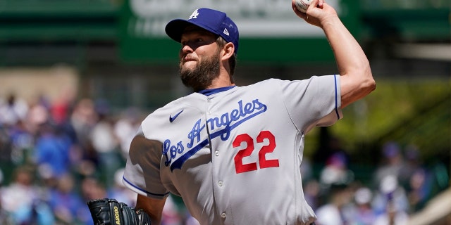 Los Angeles Dodgers starting pitcher Clayton Kershaw throws against the Chicago Cubs during the first inning in the first baseball game of a doubleheader, Saturday, May 7, 2022, in Chicago.