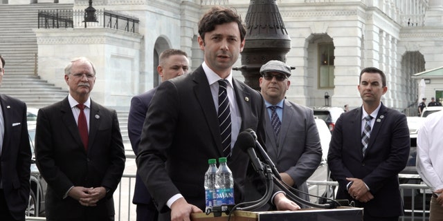 Sen. Jon Ossoff speaks in front of the Capitol building about legislation that would help first responders purchase homes.