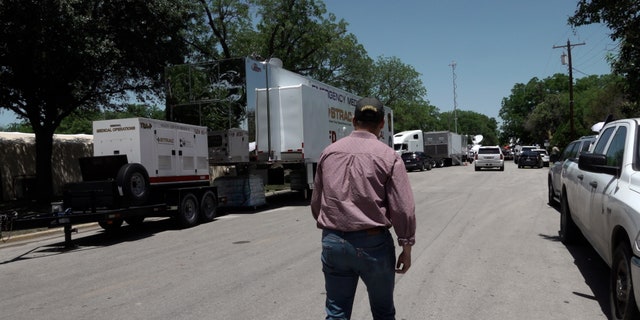 Rep. Gonzales walks across the street from Robb Elementary School in Uvalde, Texas.