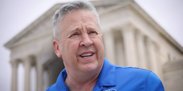 Former Bremerton High School assistant football coach Joe Kennedy answers questions after his case was argued before the Supreme Court, April 25, 2022.