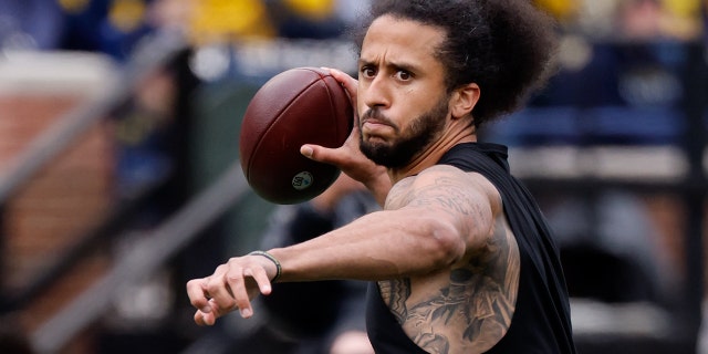 Apr 2, 2022; Ann Arbor, Michigan, USA; Colin Kaepernick passes during halftime at the Michigan Spring game at Michigan Stadium.