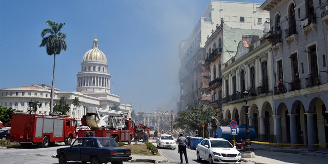 Rescuers work following the explosion on Friday, May 6.