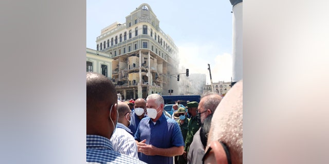 Cuban President Miguel Díaz-Canel Bermúdez is seen in front of the Hotel Saratoga following the explosion.