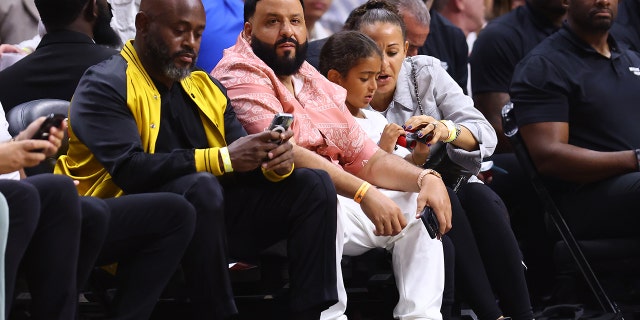 DJ Khaled gives Heat coach Erik Spoelstra brief massage during Game 5 victory