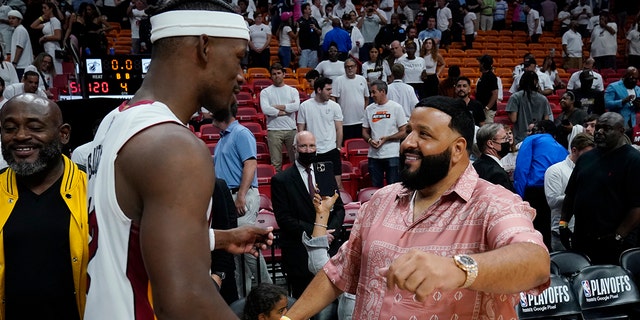 Heat forward Jimmy Butler, is congratulated DJ Khaled after the win over the Philadelphia 76ers, Tuesday, May 10, 2022, in Miami.