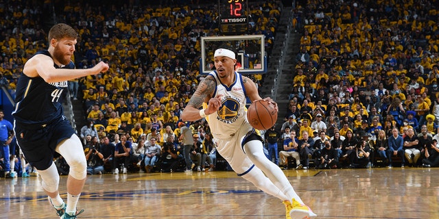 Damion Lee #1 of the Golden State Warriors drives to the basket during Game 2 of the 2022 NBA Playoffs Western Conference Finals against the Dallas Mavericks on May 20, 2022 at Chase Center in San Francisco, California.