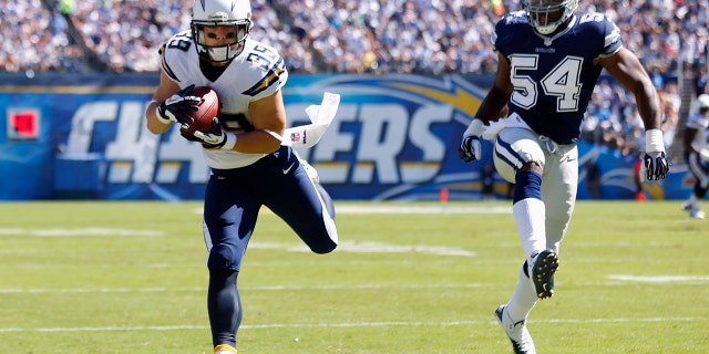 San Diego Chargers running back Danny Woodhead (39) catches a first half touchdown pass against Dallas Cowboys outside linebacker Bruce Carter (54) during their NFL football game in San Diego, California September 29, 2013.