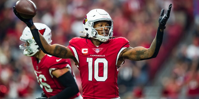 Cardinals wide receiver DeAndre Hopkins celebrates after scoring a touchdown against the Houston Texans at State Farm Stadium on Oct. 24, 2021, in Glendale, Arizona.