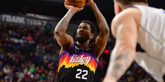 Deandre Ayton of the Suns shoots against the Dallas Mavericks during Game 7 of the semifinals on May 15, 2022, at Footprint Center in Phoenix, Arizona.