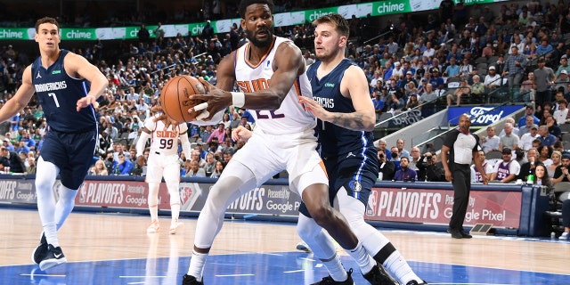Deandre Ayton of the Phoenix Suns handles the ball during Game 6 of the semifinals against the Mavericks on May 12, 2022, at the American Airlines Center in Dallas, Texas.