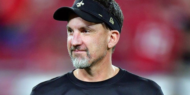 Dennis Allen of the New Orleans Saints watches warmups before the Buccaneers game at Raymond James Stadium on Dec. 19, 2021, in Tampa, Florida.