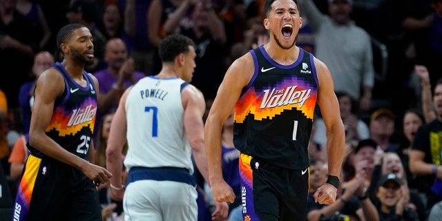 Phoenix Suns Guard Devin Booker (1) celebrates the basket with the Dallas Mavericks in the first half of Game 1 in the second round of the NBA Western Conference Playoffs on May 2, 2022 in Phoenix.