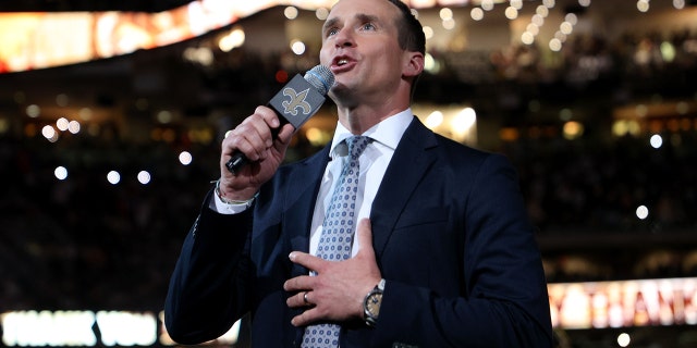 Former quarterback Drew Brees talks to fans during half-time of the game between the Buffalo Bills and Saints at Kaiser Superdome on November 25, 2021 in New Orleans.