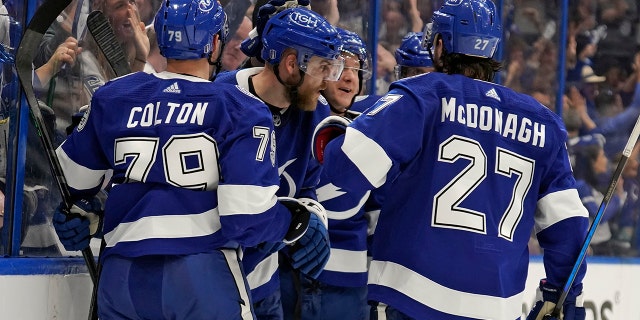 Tampa Bay Lightning defender Eric Chernak (81, center) celebrates his goal against